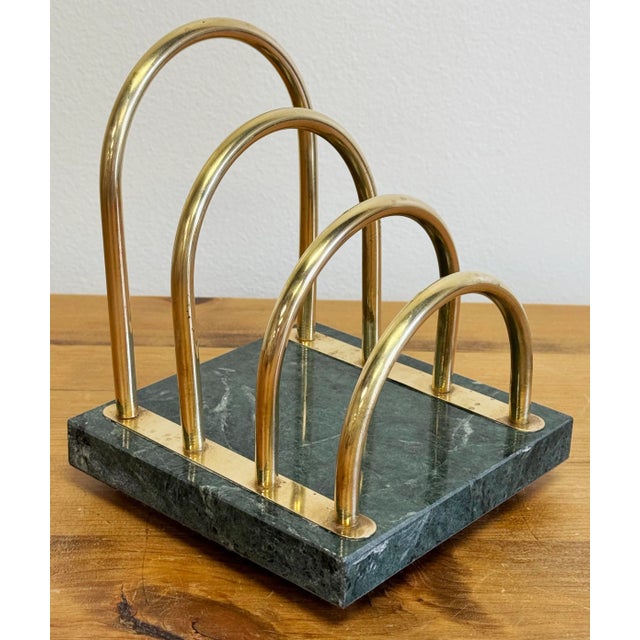 Substantial vintage brass letter holder with green marble base. Marble base features brass button feet.