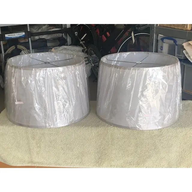 Pair of beautiful Zeugma silk silver grey lamp shades. Hardback. 15 x 16 x 11. In perfect condition.