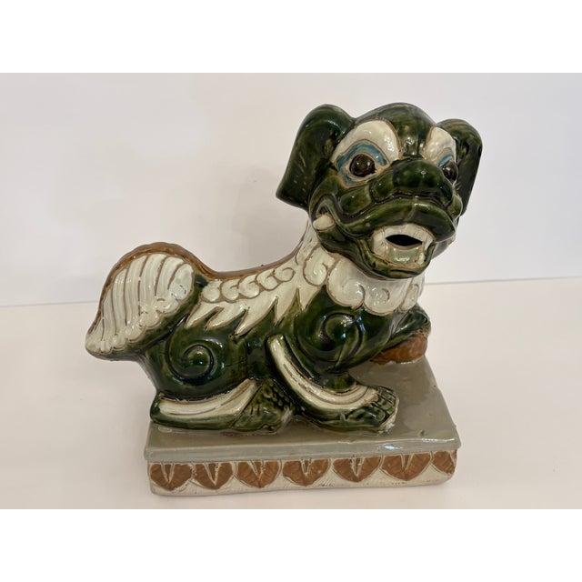These foo dogs stand at 10" high, 10.5" long and 5" wide; they were made during the 1960's. I purchased these while on...