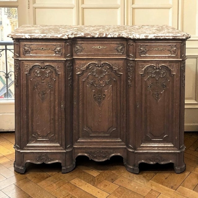 Crafted in the renowned workshops of Liège, Belgium, this exceptional Louis XIV style buffet reflects the extraordinary...