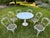 A complete seven-piece vintage dining set in Woodard’s coveted “Chantilly Rose” pattern, produced by Woodard of Owosso,...