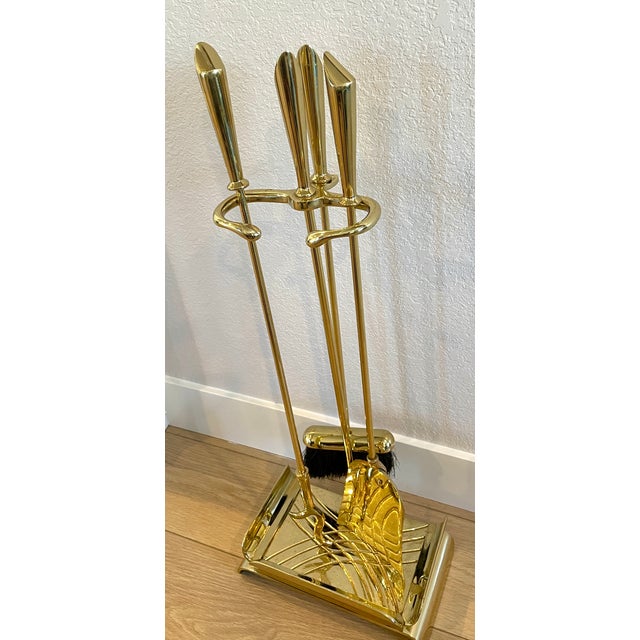 Modernism at its finest in a lacquered brass fireplace set, this one's a show stopper. Angled handles and the heavy...