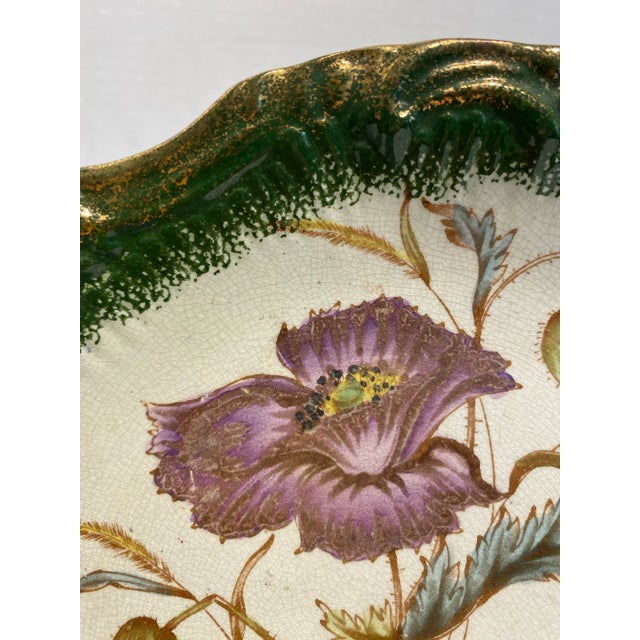 The colors of purple, soft blues and yellow are very lovely on this British Registered Design Decorative Plate. The deep...