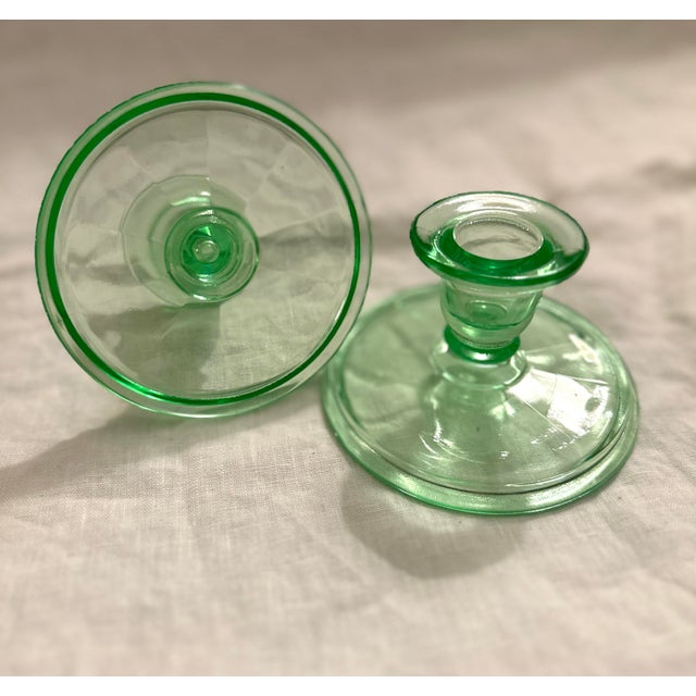 Vintage pair of light green depression glass pillar holders. Perfect paired with other green glass designs. Also just in...