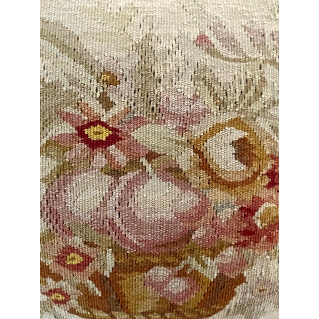 This Antique Aubusson Pillow features a beautiful floral border design and fringed edge, showcasing exquisite...