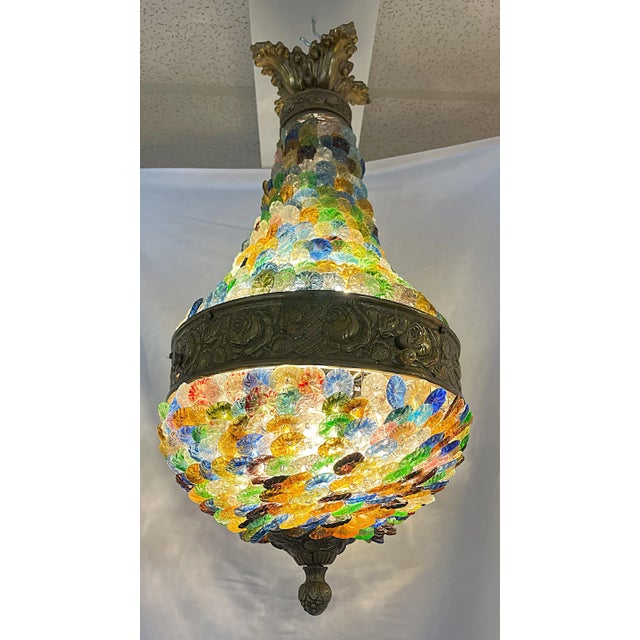 A wonderful Neoclassical Art Deco chandelier produced in Italy around the 1940-50s. It is made of colorful Italian Murano...