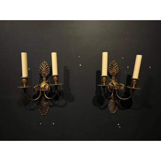 A pair of French empire double light sconces. Made in the 1930s.