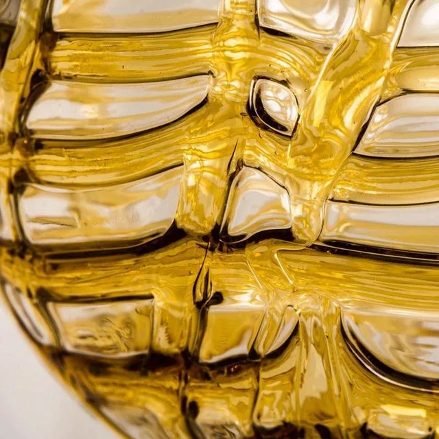 One of the three doria pendant lights (in collaboration with murano) in the style of venini, manufactured, circa 1960....