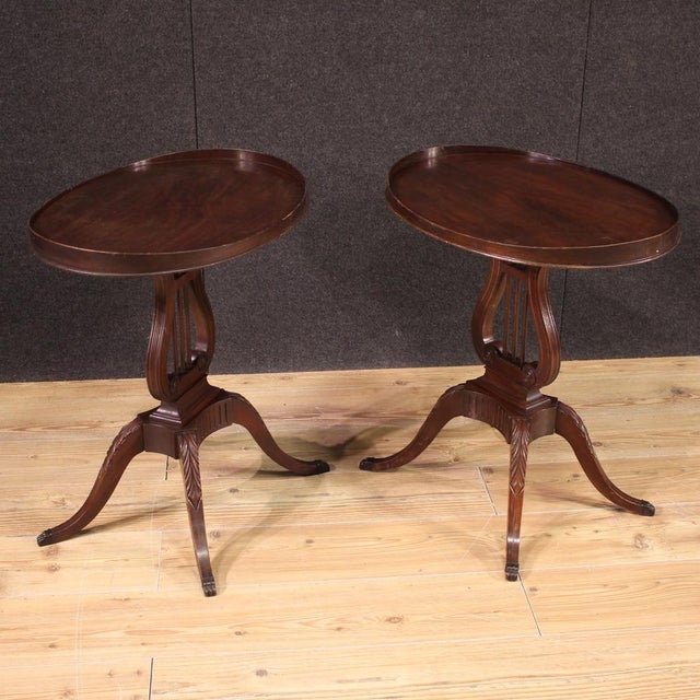 Pair of English side tables from the mid-20th century. Regency / Empire style furniture finely carved in high quality...