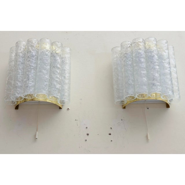 This lovely pair of Art Deco style vintage wall sconces have the textured 6 ice glass pipes as the front in a curve. The...