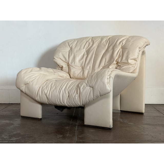 1970's soft beige Swiss leather chair in good vintage condition. Some minor stains on the leather, small nicks consistent...