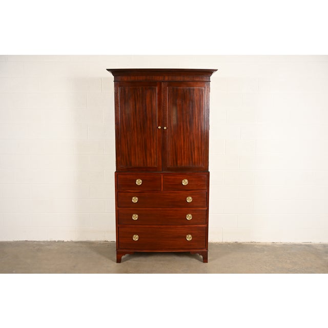 A gorgeous Federal or Hepplewhite style armoire dresser, gentleman's chest, or linen press By Baker Furniture USA, Late...