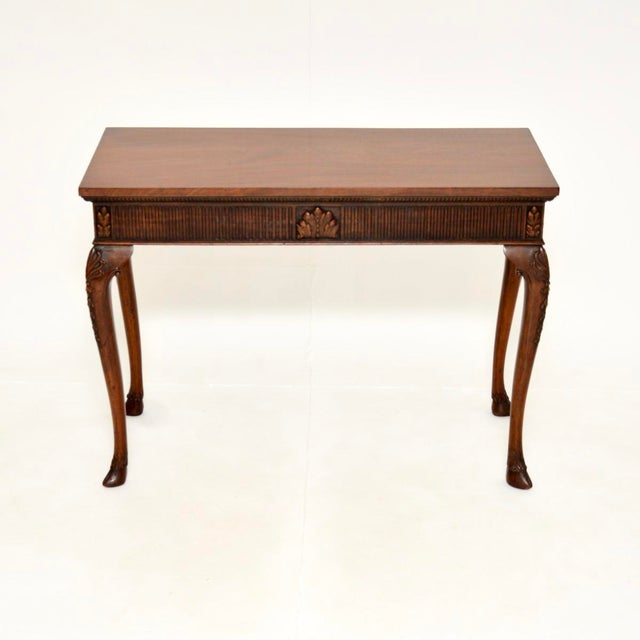 A beautiful antique console / side table, made in England and dating from around the 1890-1910 period. This has a lovely,...