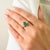 This elegant three-stone engagement ring features 1 marquise cut emerald totaling 0.93 carats, set in rich 18k white gold....