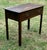 This charming late Georgian side table is a timeless piece of English craftsmanship, likely dating to the late 18th...
