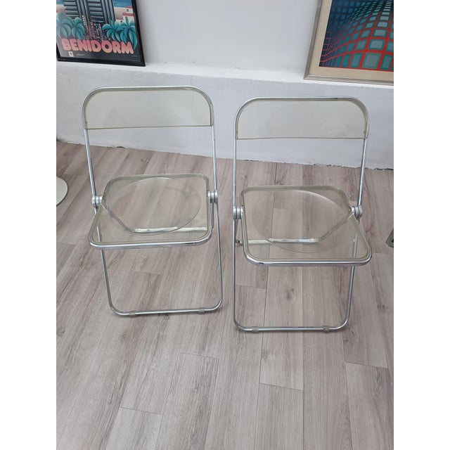 Magnificent and iconic pair of folding chairs by Giancarlo Piretti for Anonima Castelli. Italy, 1967. Chrome-plated steel...