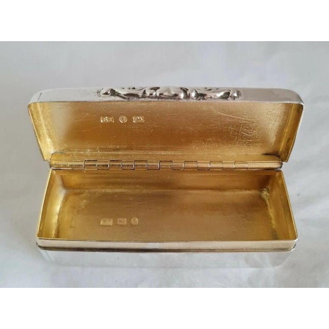 A fine antique English sterling silver snuff box by Robert Thornton, fully hallmarked for Birmingham 1867 and dating to...