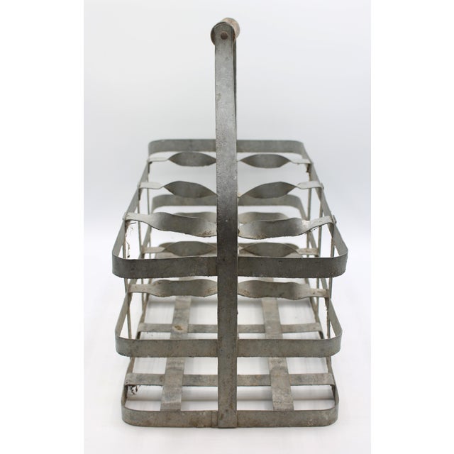Early 20th century large French 8-bottle wine carrier. Zinc, decoratively twisted dividers, with shaped treen carrying...