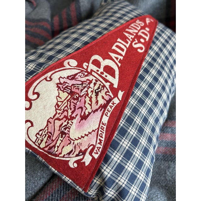 Description: Vintage Badlands South Dakota Felt Pennant from around the 1960s. Unknown Date. New navy blue plaid woven...