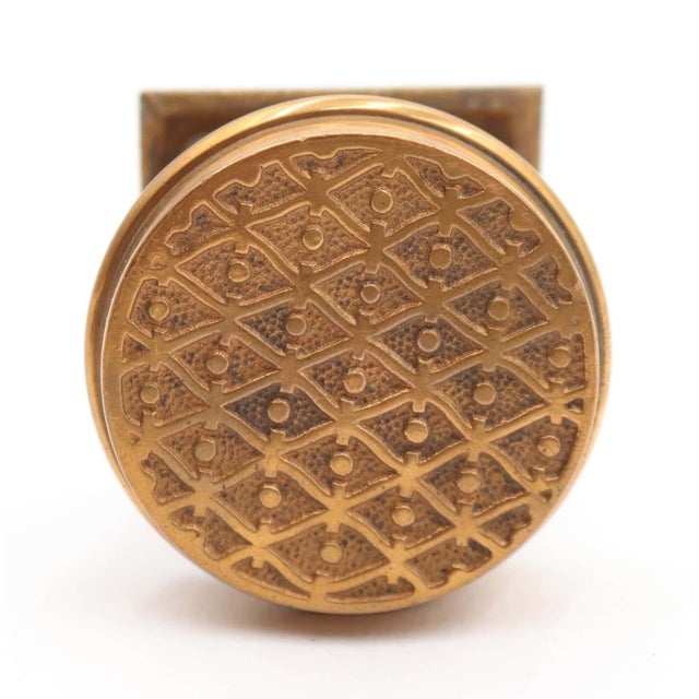 Victorian style brass dummy door knob with a field pattern knob and a square rosette. The original mounting screws are not...