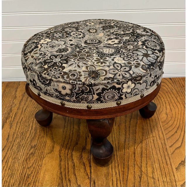 Queen Anne style footstool with mahogany turned legs. Upholstered in Burch Bountiful Gold woven fabric with matching...