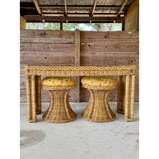 Beautiful vintage handwoven rattan console table featuring a striking braided rattan apron and sculptural wrapped legs....