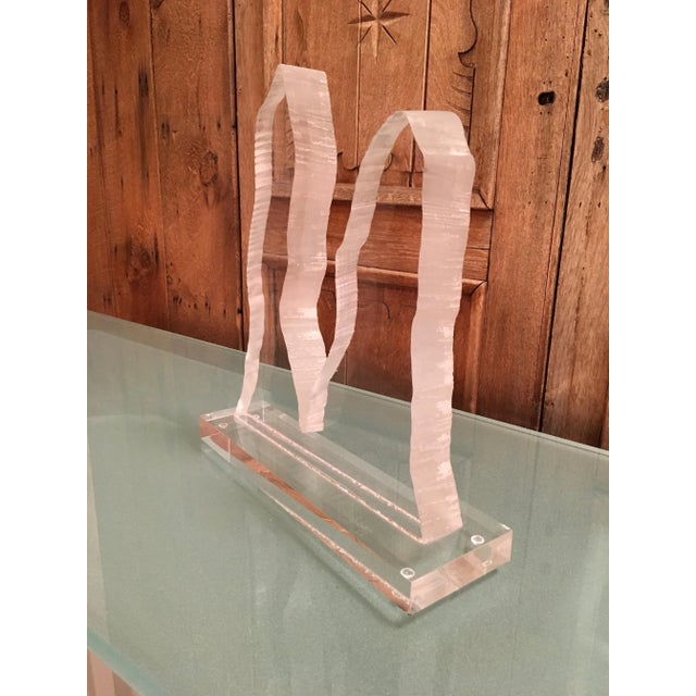 Sculpted abstract lucite on stand in the style of Van Teal. The piece was made in the late 20th century.