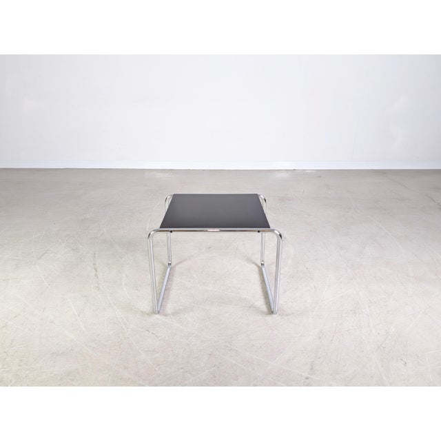We are offering a beautiful coffee/side table by KnollStudio with a black top for sale. Designed by Marcel Breuer, it...