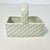 This little white ceramic rectangular faux wicker basket is a candy dish. Add colorful jelly beans and display in any room...