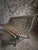 This French garden bench dates from the 1950s. It has a pair of painted iron end frames with a seat and back made from...
