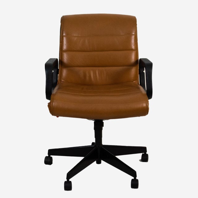 The Executive office chair designed by Richard Sapper for Knoll comes with a five star base, and upholstered in fine tan...