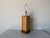 Charming vintage table lamp featuring a faux bamboo frame with woven rattan panels in a striking herringbone pattern. The...