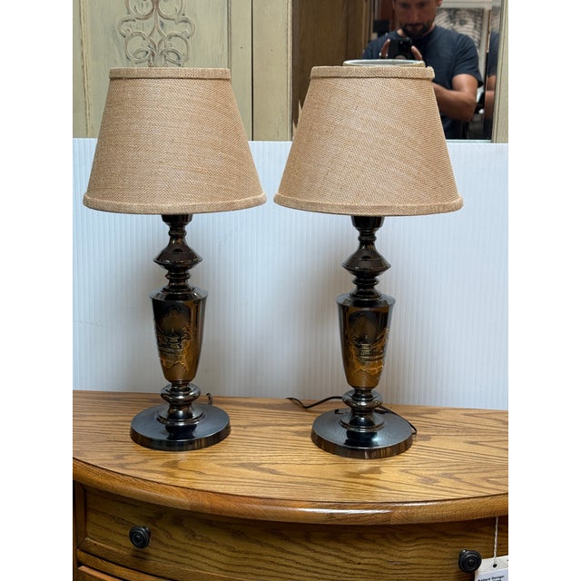 Design Pous Gallery presents a Pair of Blackened Metal Table Lamps with Etched Japanese Landscapes. The lamp are in the...