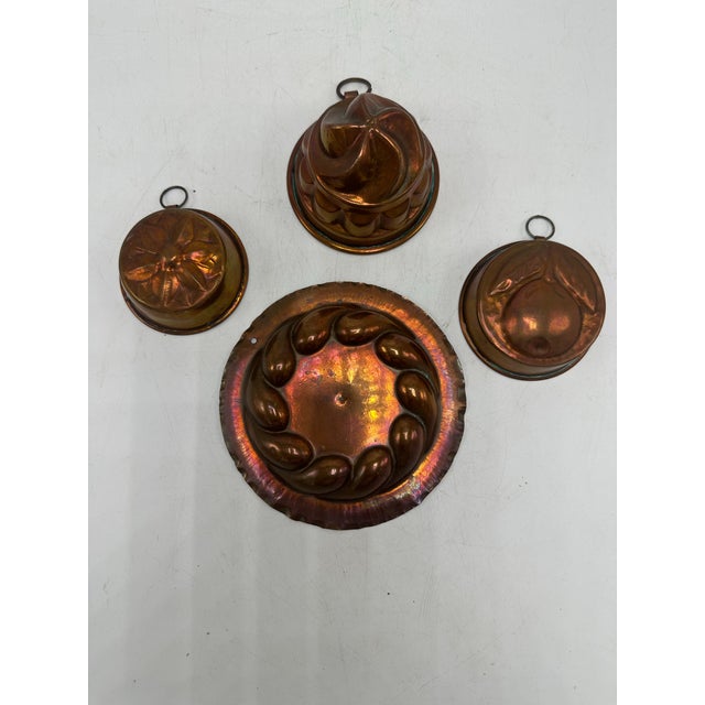 This is a cohesive collection of antique copper molds, likely late 19th to early 20th century, with strong European...