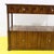 Wooden cabinet featuring turned columns and ceramic knobs.