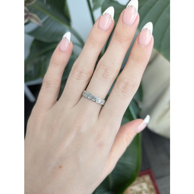 Elegant and timeless, this 1 carat lab grown diamond band ring is crafted in solid 14K gold for lasting brilliance and...