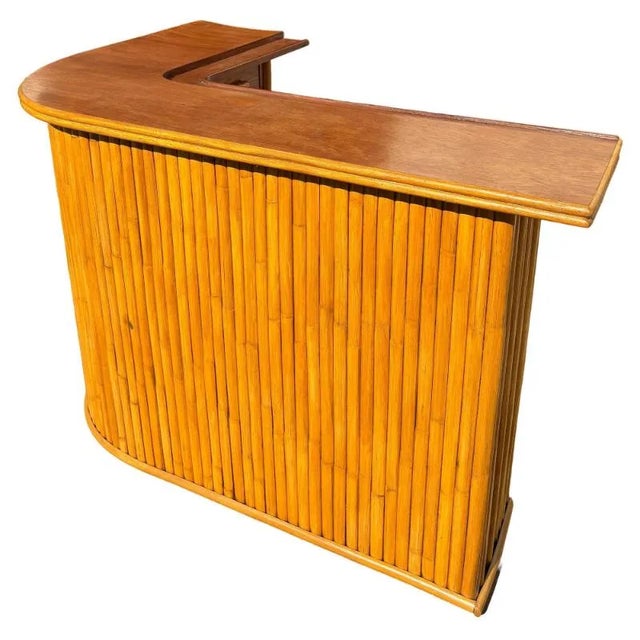 This restored dry bar showcases a distinctive stacked rattan design with a polished mahogany frame, exuding vintage...