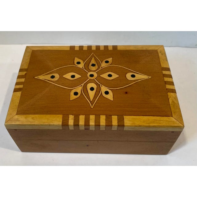 Nice vintage wooden trinket box with inlaid design.