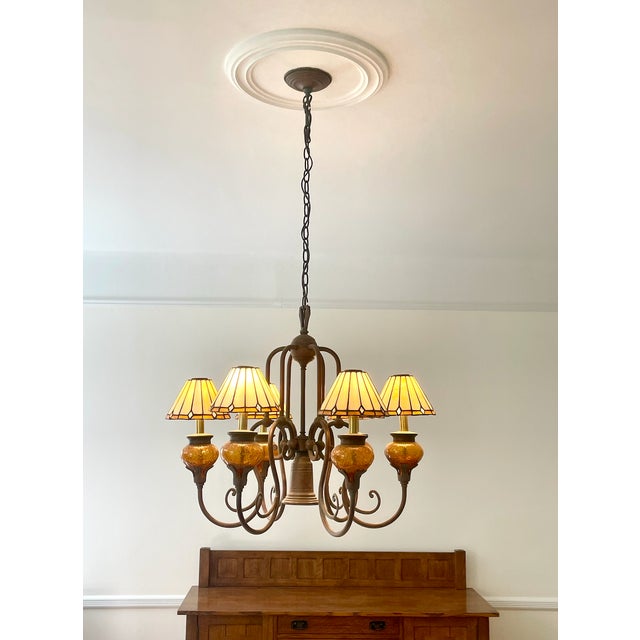 Stunning vintage Arts & Crafts style 6-light chandelier featuring warm amber textured glass shades and a rich bronze...