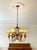 Stunning vintage Arts & Crafts style 6-light chandelier featuring warm amber textured glass shades and a rich bronze...