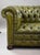 A quality traditional Chesterfield three-seater sofa, upholstered in beautifully coloured olive green leather with a rich,...