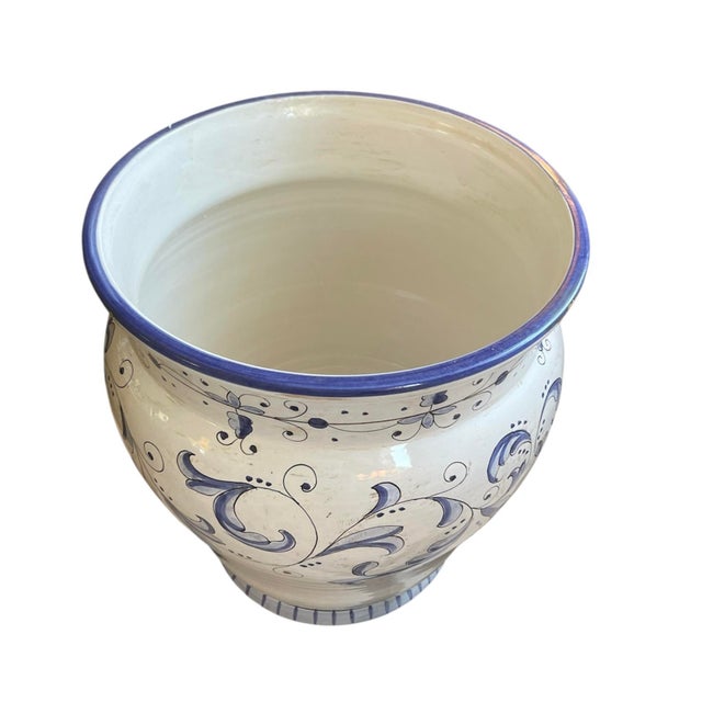 A stunning, oversized Italian Majolica ceramic cachepot or floor planter featuring a timeless blue and white color...