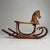 This antique Japanese wooden rocking horse from the 1920s is a particularly charming object with a warm, playful presence....