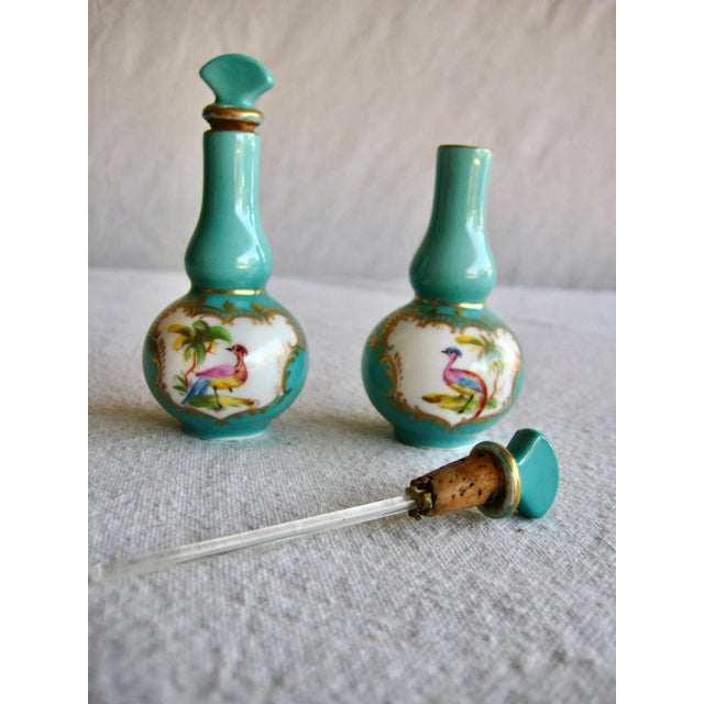 This charming pair of perfume bottles , present a typical decor from the 1700 hundreds and so is the coloring you will...