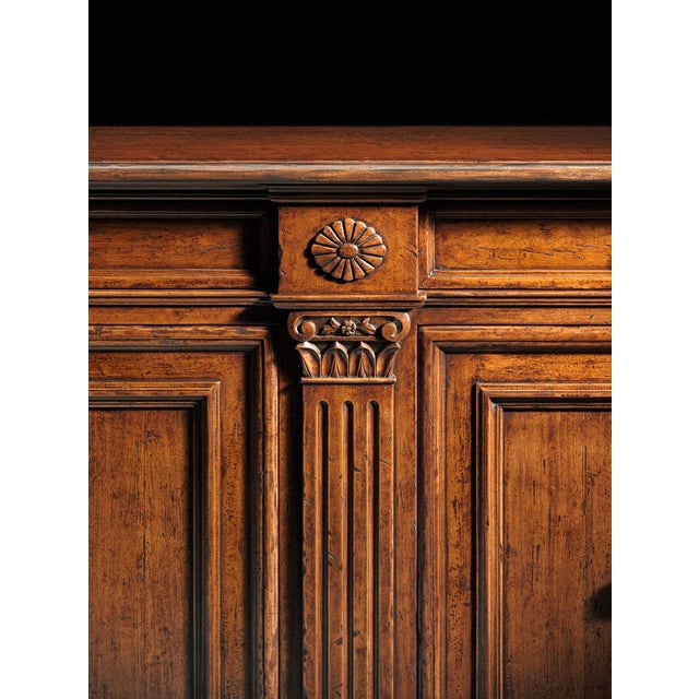 Handcrafted in Italy, this Tuscan style sideboard features fluted pilasters with hand-carved capitals that add...