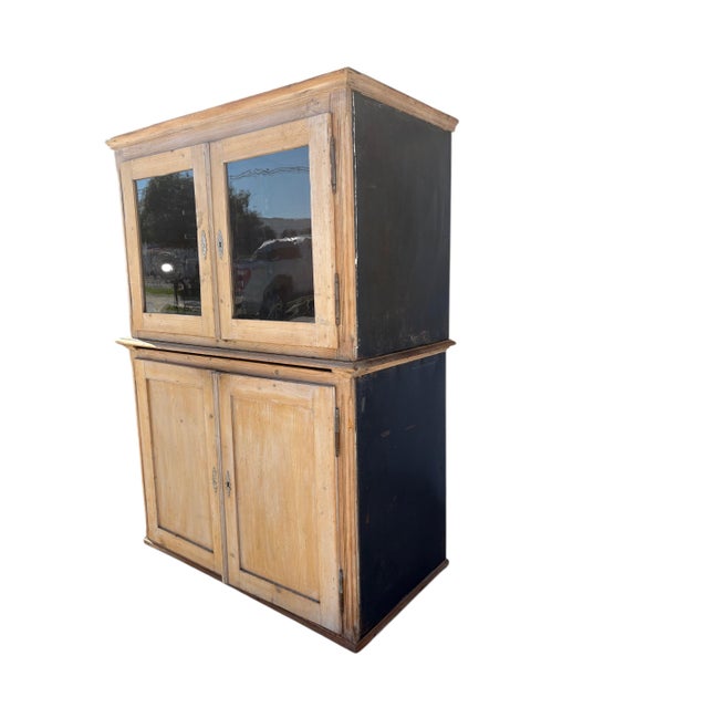 A "rare" Original 2 part French Pine Bakers Cabinet. Glass doors to the top and solid to the base. The cabinet has all its...