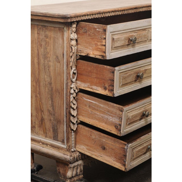 An impressive Italian Baroque four drawer chest, with robust carvings and sculptural ornamentation, from the 18th century....