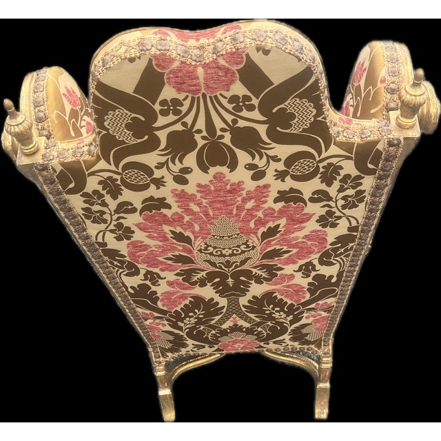 An extraordinary mid-20th-century Venetian Rococo revival high-back wingback armchair featuring an intricately hand-carved...