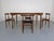 Extendible teak table and four chairs manufactured by Frem Røjle and designed by Hans Olsen. Chairs and table are made...