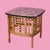 Add exotic elegance to your living space with this pair of fretwork burnt bamboo glass top end tables. The intricately...